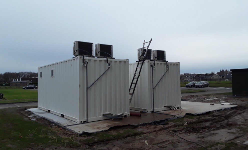 White 20ft shipping containers with airco as technical area